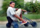 PedalPower-KidCar-2 copy  Geoffrey Blakely, 11, makes his way up the road riding in a toy pedal car near his home in Arkwright, SC Monday afternoon, 8-7-06.  (AP Photo/Spartanburg Herald-Journal/Tim Kimzey).